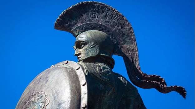 Spartan warrior with shield wearing helmet